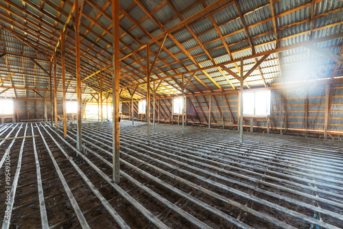 Open Attic With Timber Framework. Expansive Attic Area Featuring Wooden Trusses And Potential Uses