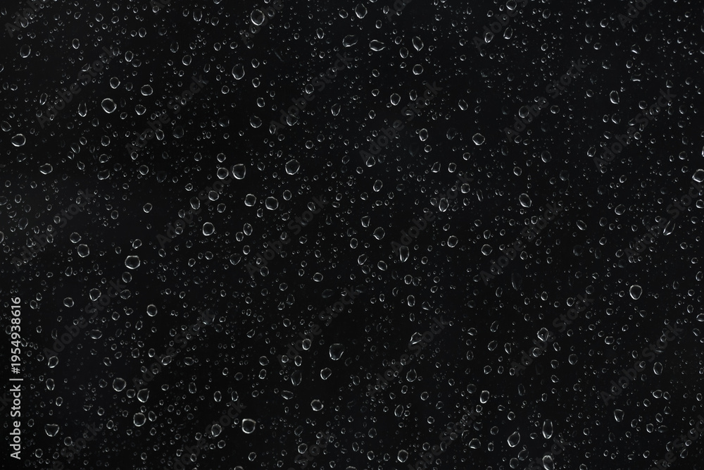 Obraz premium Raindrops on glass window isolated on transparent background. High-contrast water droplet texture for cinematic overlays, stormy weather effects, and atmospheric digital art backgrounds