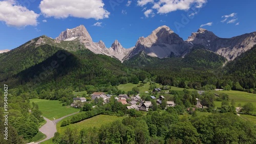 Aerial view of La Jarjatte village in the Vercors Natural Park. Limestone mountain peaks of Devoluy Massif, Drome, French Alps, France