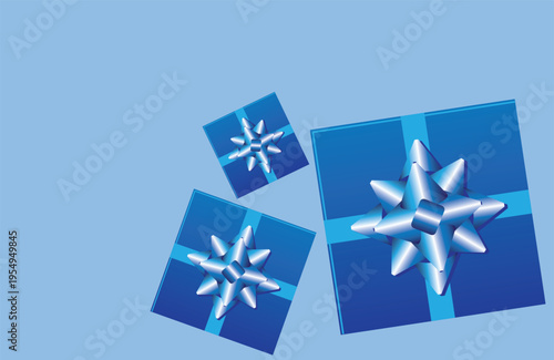 Blue gift boxes with bright ribbons on a flat background with copy space