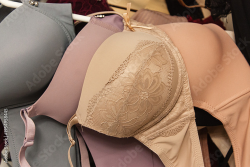 Beautiful woman push up bra in many colors on the hangers. 