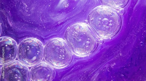 Abstract macro photography of purple liquid with bubbles
