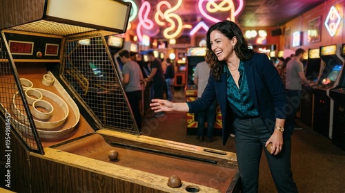 Woman playing skee ball arcade game in retro arcade with neon lights
