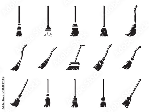 A collection of brooms with different shapes and sizes