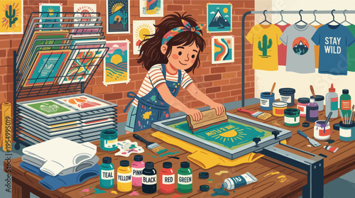 A young girl screen printing colorful designs in a creative workspace studio