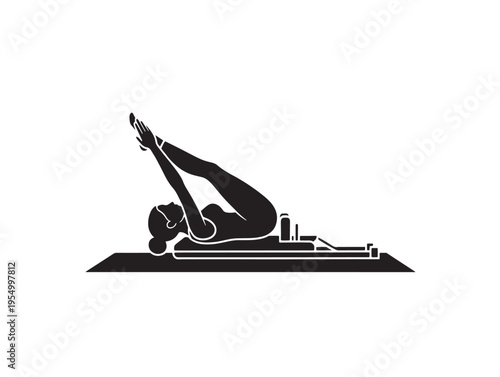 Woman performing pilates exercise on a reformer machine