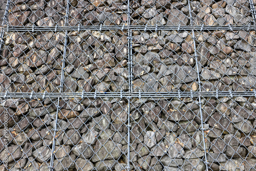 Gabion Wire Mesh Filled with Rocks, steel net as security against falling rocks.