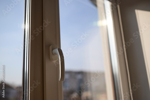Tableau sur toile Modern white plastic window handle for opening and closing