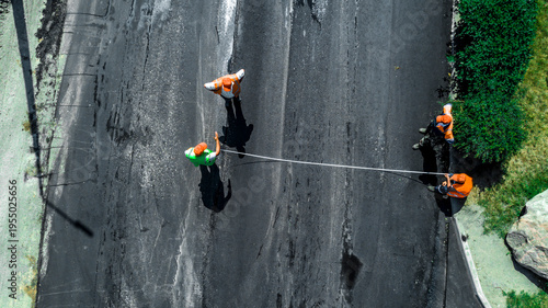 Aerial view on the new asphalt road under construction