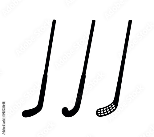Three solid black hockey sticks with different blade shapes arranged side by side.