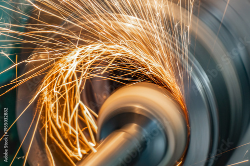 Photography In a well-lit workshop during daylight hours, the metal grinding process is gene