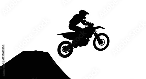 Silhouette of Motocross Rider Jumping Over Ramp