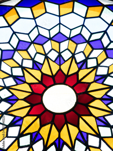 Colorful stained glass window with geometric pattern in Cordoba, Spain