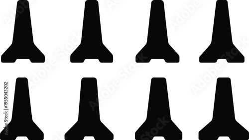 Eight Black Concrete Jersey Barriers Arranged in Two Rows on a White Background concrete barrier traffic barrier