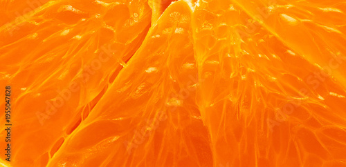 Macro Shot of Fresh Juicy Orange Pulp Texture,Extreme close-up macro shot of vibrant orange fruit pulp and segments. The image highlights the detailed texture, juice vesicles, and bright citrus colors