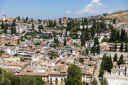 Panoramic view of Granada city with traditional houses and hills, Spain