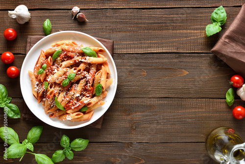 Tableau sur toile Italian penne pasta with tomato bolognese sauce on plate