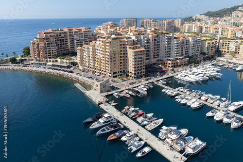 Aerial view of Monaco marina with boats and coastline
