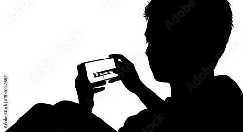 Silhouette of a Person Using a Smartphone