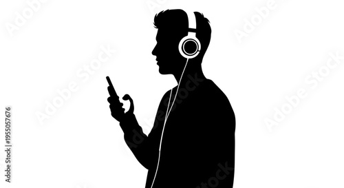 Silhouette of a young man listening to music with headphones and smartphone