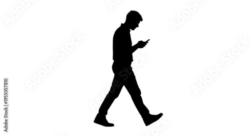 Silhouette of a Man Walking and Using a Smartphone