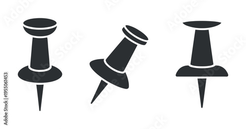 Three Black Pushpins Arranged and Isolated on a White Background