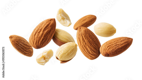 Isolated flying raw and blanched almonds with skin, whole and broken pieces, healthy snack