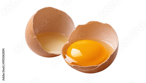 Tableau sur toile Isolated fresh raw chicken egg cracked in two halves with bright yellow yolk and