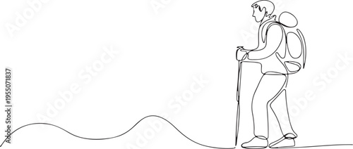 Trekker with backpack and walking poles on a contoured path