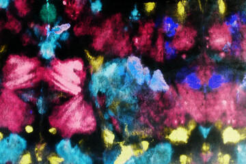 Colorful abstract floral texture with tie-dye effect and soft watercolor patterns. Vibrant artistic background with organic shapes, fabric-like surface and expressive paint details.