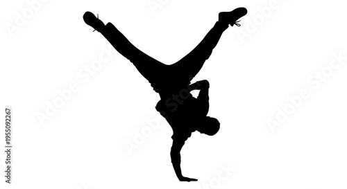 Silhouette of a Breakdancer Performing a One-Handed Freeze