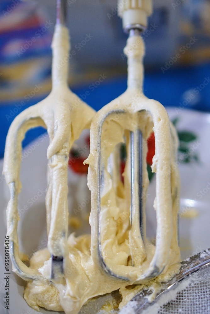 custom made wallpaper toronto digitalClose-up of cake batter sticking to mixer beaters, showing soft texture and baking process in the kitchen.