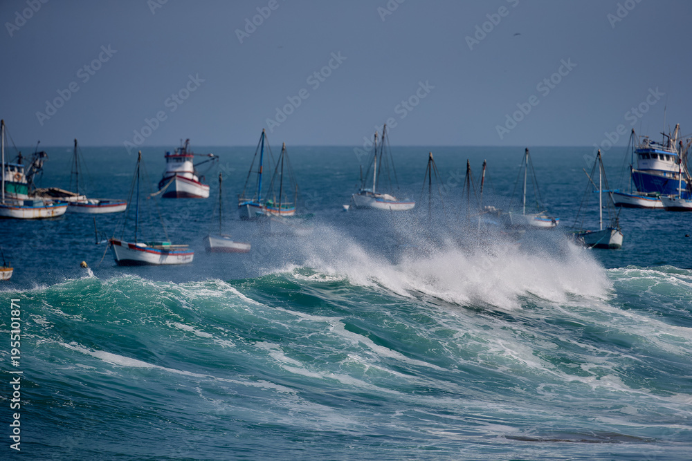Fototapeta premium Powerful Pacific swell barrels along the iconic pier of Cabo Blanco, a legendary surf destination where pristine waves, rich fishing heritage, and authentic coastal culture come together,