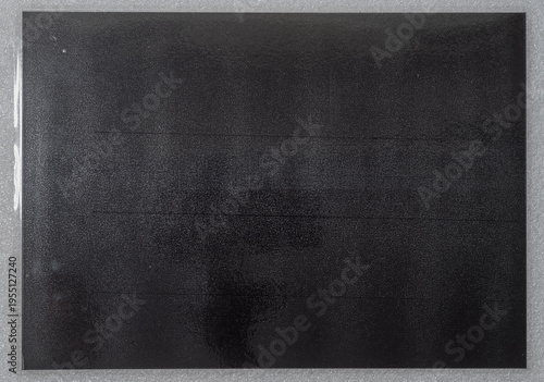 Fotografia Gray laminated copy paper texture with glossy surface and subtle reflections, cool paper and foil overlay