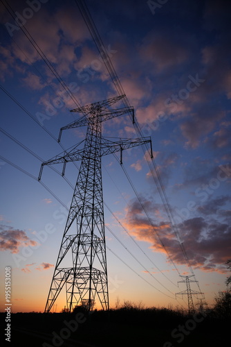 Electricity Pylon Silhouette Against Colorful Sunset Sky
