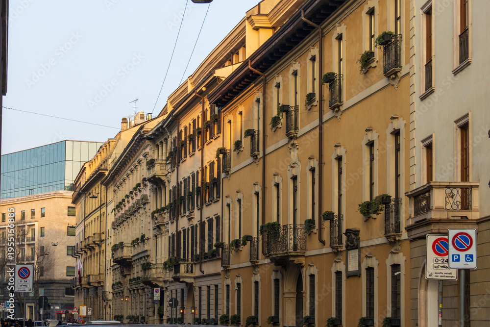 Fototapeta premium Apartments, restaurants and shops along a street in Milan Italy IT