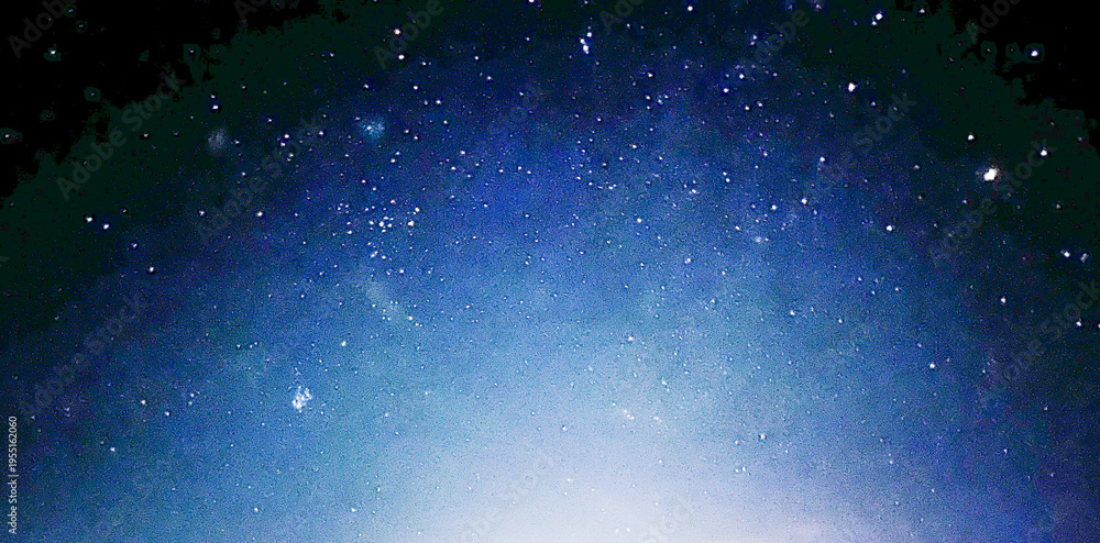 Fototapeta premium Night blue sky with bright light. Copy space
