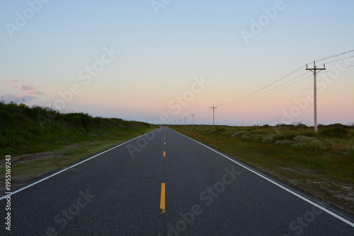 Sunrise on coastal highway Route 12, which runs through the sand dunes on the Outer Banks of North Carolina.