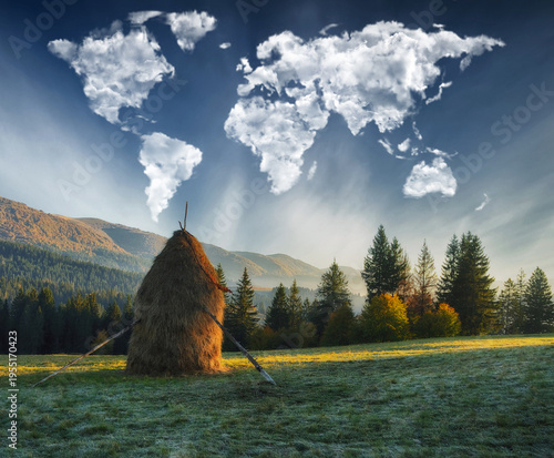 clouds in the form of a map of the world over the mountains. autumn dawn in the Carpathians. Travel and landscape concept 