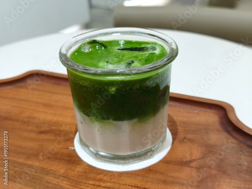 Green matcha iced drink in clear glass