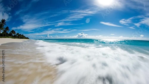 Stunning beach scene with pristine white sand, turquoise water, and a bright sunny blue sky on a beautiful day