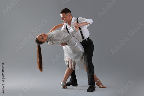 Bilde på lerret Couple of professional dancers on grey background