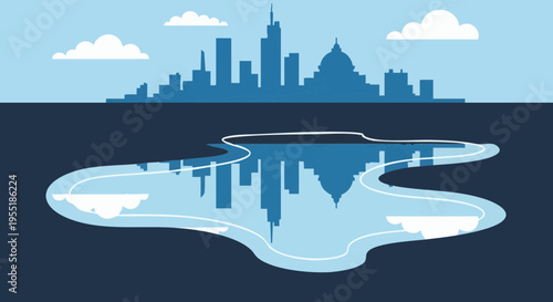 Urban cityscape with building skyline and clouds reflected in a water puddle.