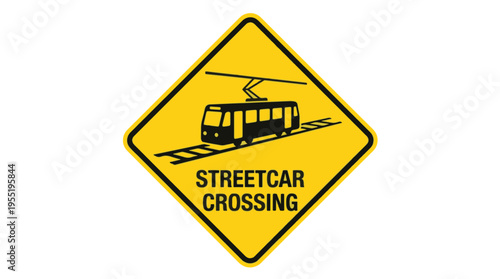 Yellow diamond warning sign with a black illustration of a streetcar on tracks and the words STREETCAR CROSSING below it.