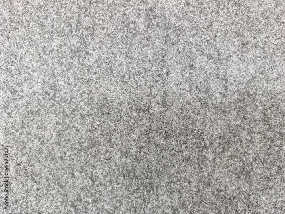 Fototapeta premium Close-up textured abstract background of soft grey speckled material for design and decor