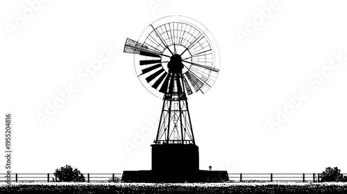 Silhouetted windmill, situated upon a base, features a circular, multi-bladed mechanism