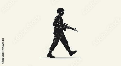 Soldier walking with a rifle.