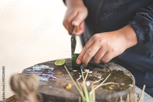 Person slicing fresh lime o...