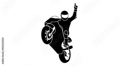 Silhouette of a stunt rider performing a wheelie with victory gesture