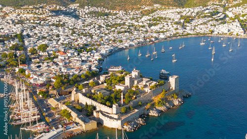 Wallpaper Mural Bodrum, Turkey. Evening aerial drone view of Bodrum Castle illuminated by sunset, with yachts in bay, beaches and white houses on coastline.. Aerial View Torontodigital.ca